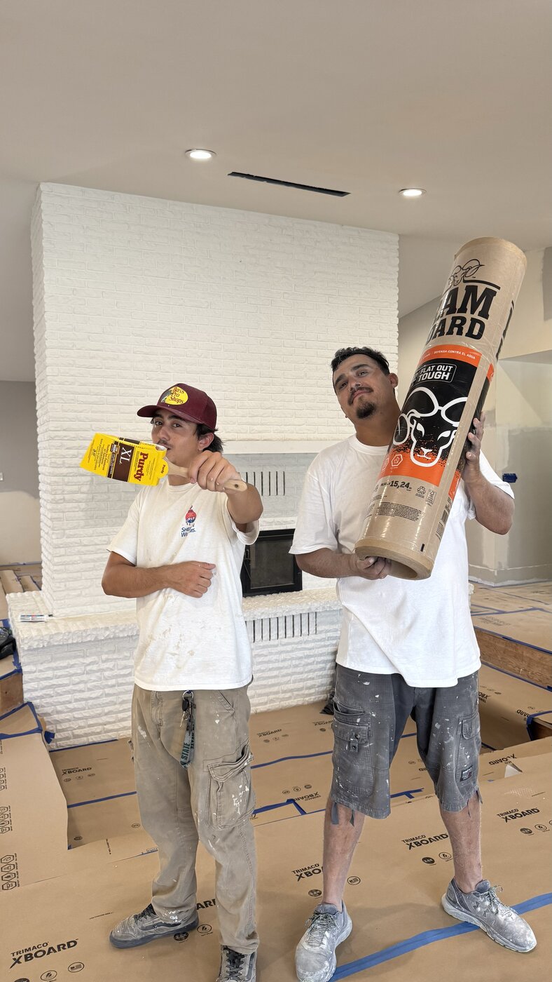 SLW crew after finishing a white brick fireplace