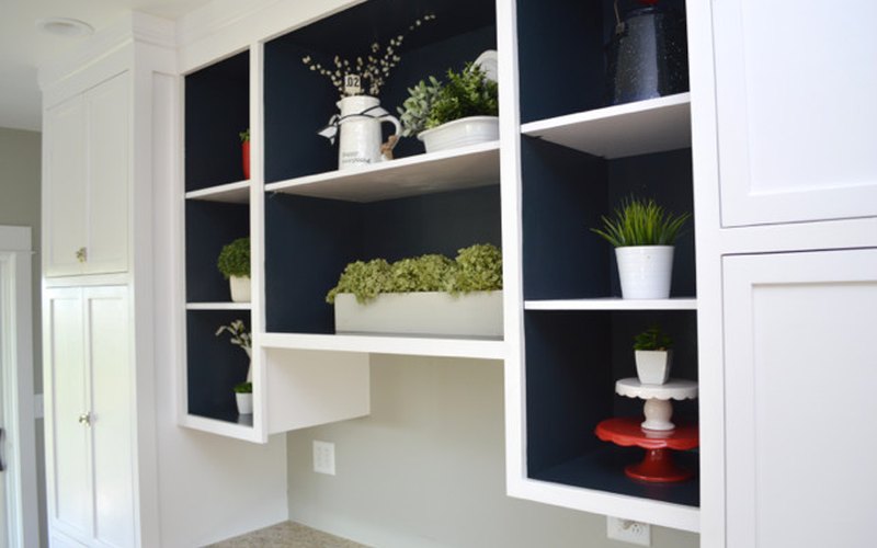 Painted built-in shelves with navy interior