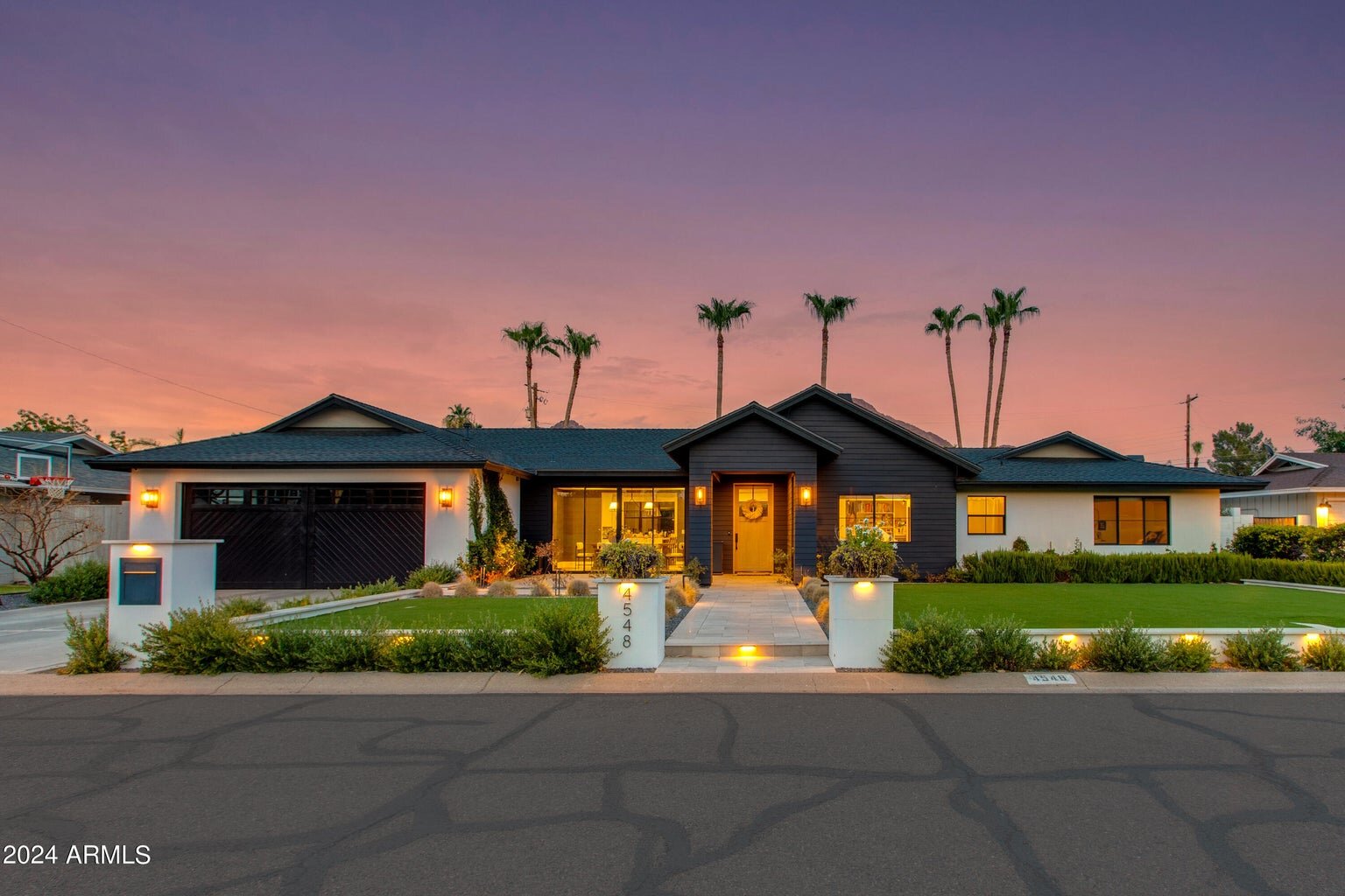 Modern dusk exterior with black and white siding