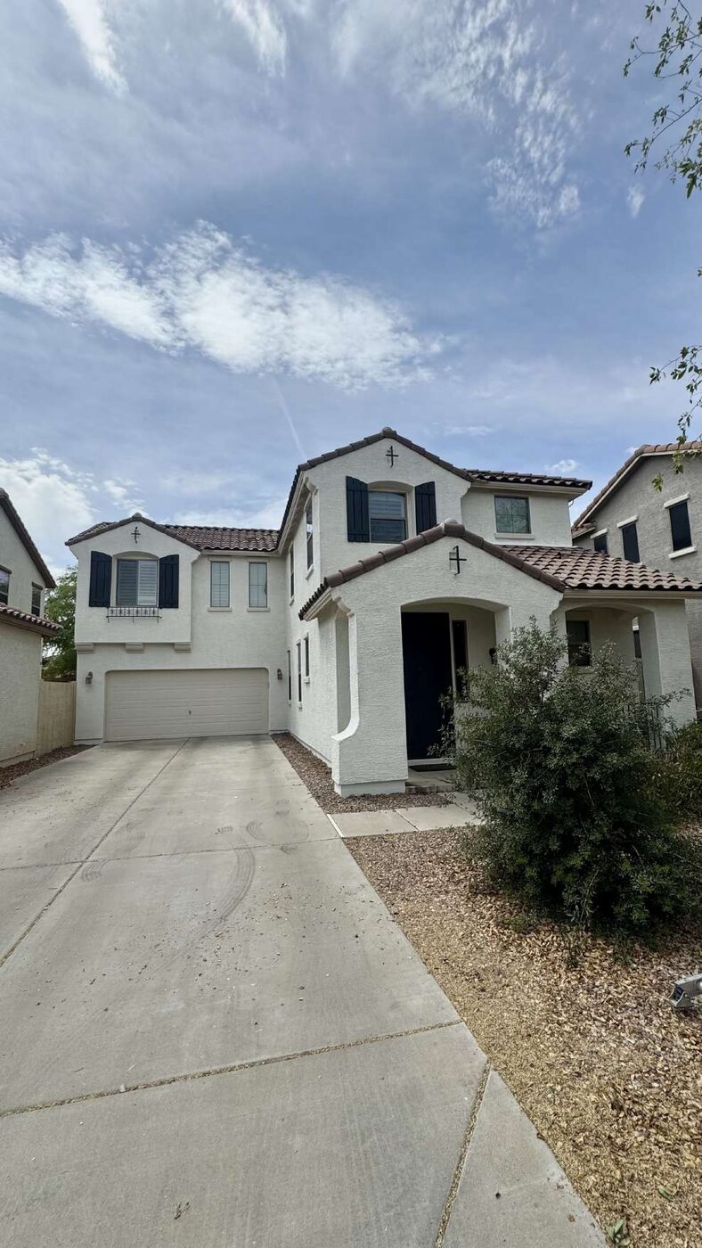 Two-story white stucco home exterior